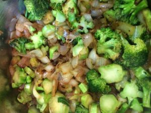 Broccoli amnd onions browning in pan